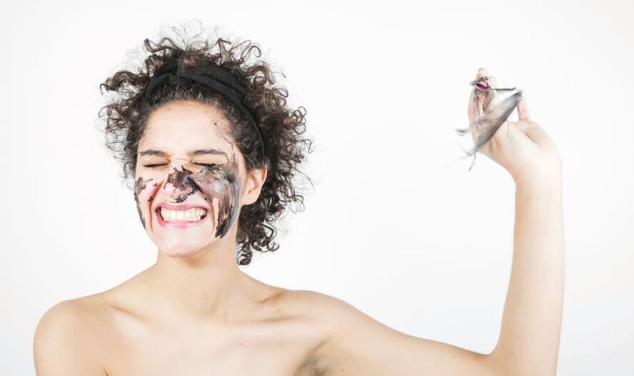 a woman performs rejuvenating facial skin treatment